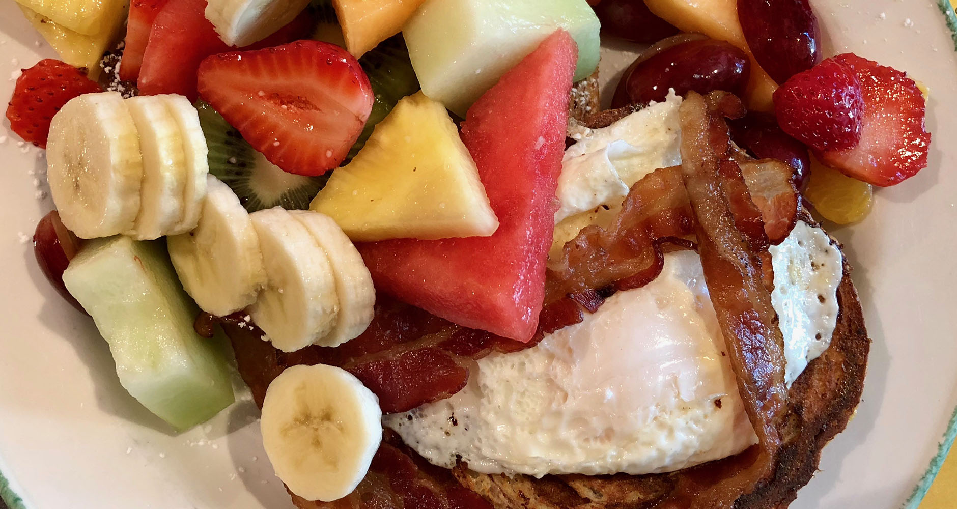 French toast with bacon, eggs and fruit at Cora, Downtown Vancouver, Canada